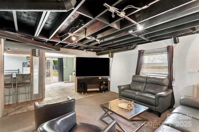 213 Lakeview Dr, Harrisburg, NC 28075 - living room featuring concrete block wall