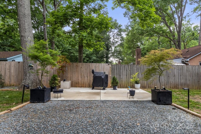 fenced backyard with a patio
