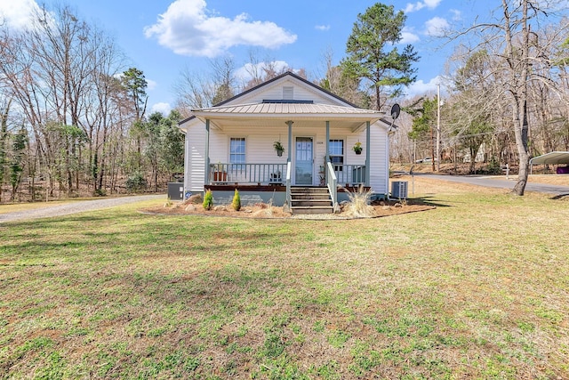 1339 Hill St, Albemarle, NC 28001 - view of front of house featuring covered porch, a front yard, and a metal roof