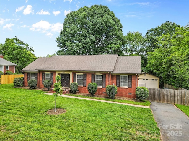 ranch-style house with brick siding, crawl space, roof with shingles, and a garage
