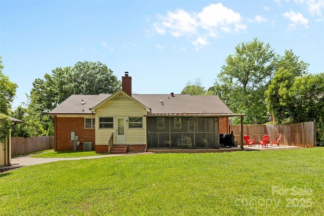 rear view of house with a sunroom, central AC unit, brick siding, entry steps, and a chimney