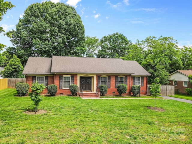 ranch-style home with crawl space, brick siding, and a shingled roof