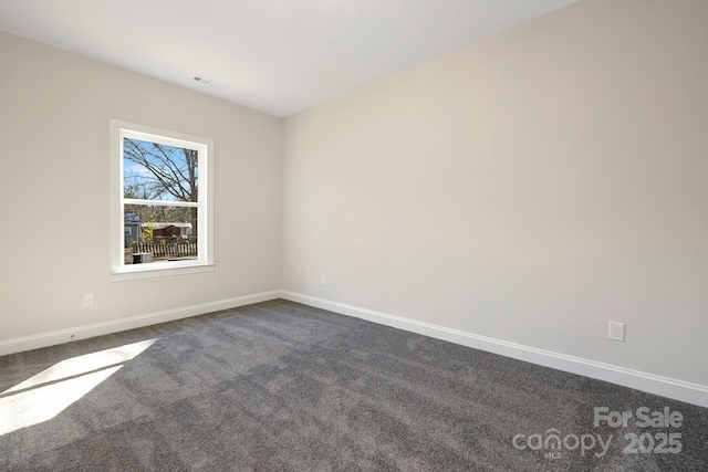 514 Rich St, Rock Hill, SC 29730 - empty room with baseboards and dark colored carpet