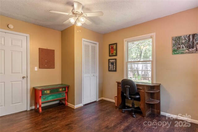 office with baseboards, a ceiling fan, a textured ceiling, and wood finished floors