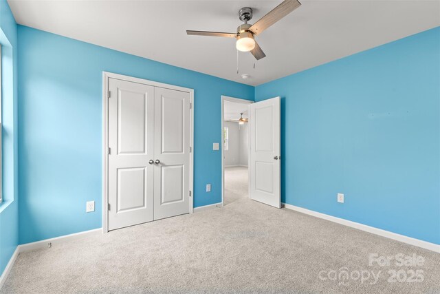 423 Shallowford Dr, Rock Hill, SC 29732 - unfurnished bedroom featuring carpet flooring, baseboards, a closet, and a ceiling fan