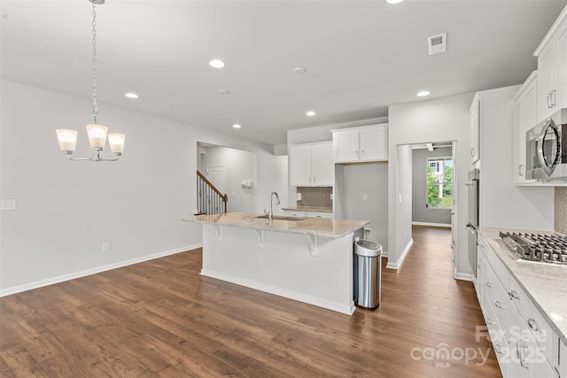 423 Shallowford Dr, Rock Hill, SC 29732 - kitchen with appliances with stainless steel finishes, a sink, dark wood-type flooring, recessed lighting, and white cabinetry