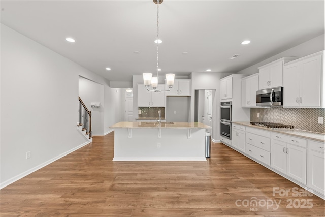 423 Shallowford Dr, Rock Hill, SC 29732 - kitchen with appliances with stainless steel finishes, a sink, tasteful backsplash, white cabinets, and recessed lighting