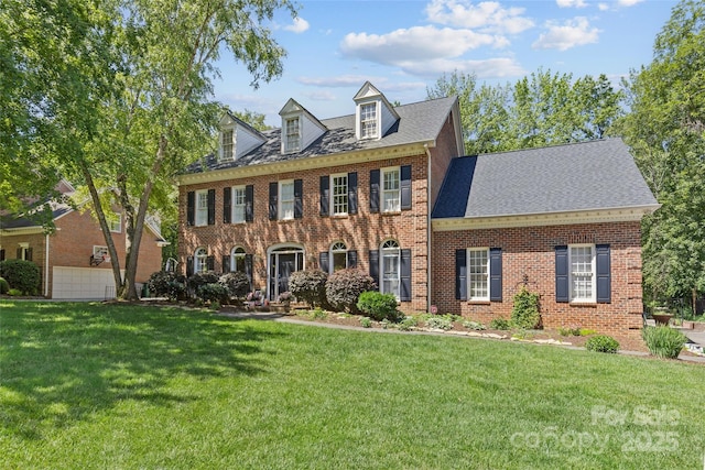9513 Tresanton Dr, Charlotte, NC 28210 - georgian-style home featuring brick siding, a front lawn, and a shingled roof