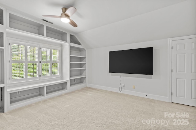 9513 Tresanton Dr, Charlotte, NC 28210 - additional living space featuring built in shelves, carpet, a ceiling fan, baseboards, and vaulted ceiling