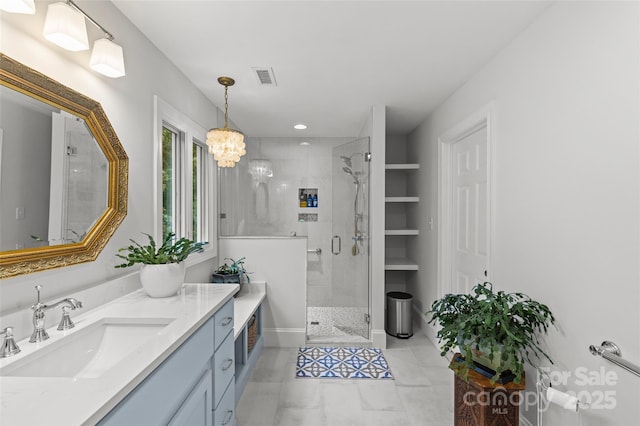 9513 Tresanton Dr, Charlotte, NC 28210 - full bath with vanity, a stall shower, a chandelier, and baseboards