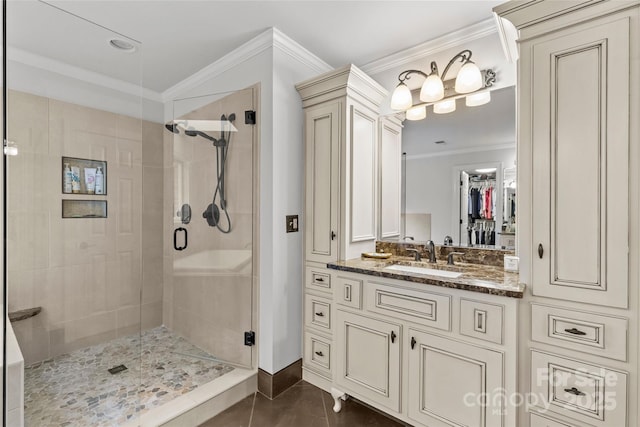 9513 Tresanton Dr, Charlotte, NC 28210 - bathroom with a stall shower, crown molding, vanity, baseboards, and a spacious closet