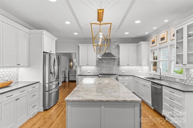9513 Tresanton Dr, Charlotte, NC 28210 - kitchen with stainless steel appliances, a sink, wall chimney range hood, a center island, and crown molding