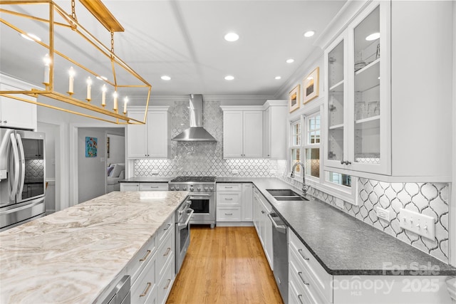 9513 Tresanton Dr, Charlotte, NC 28210 - kitchen with wall chimney exhaust hood, appliances with stainless steel finishes, a sink, backsplash, and white cabinetry