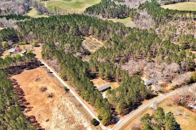drone / aerial view with a view of trees and a rural view