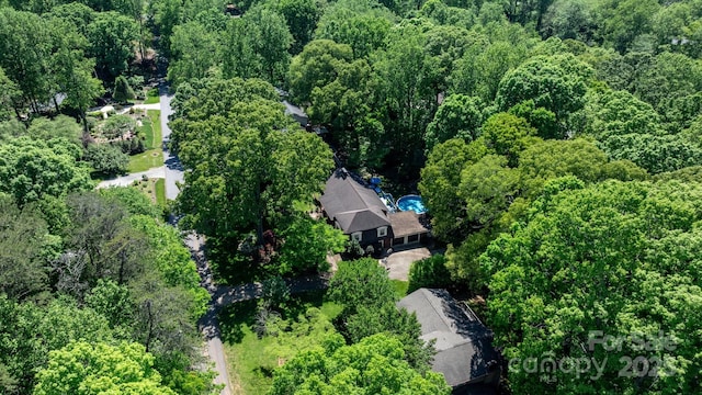 bird's eye view with a forest view