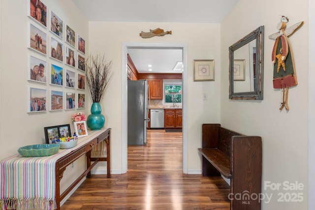 701 5th Ave NE, Conover, NC 28613 - corridor with wood finished floors, baseboards, and a sink