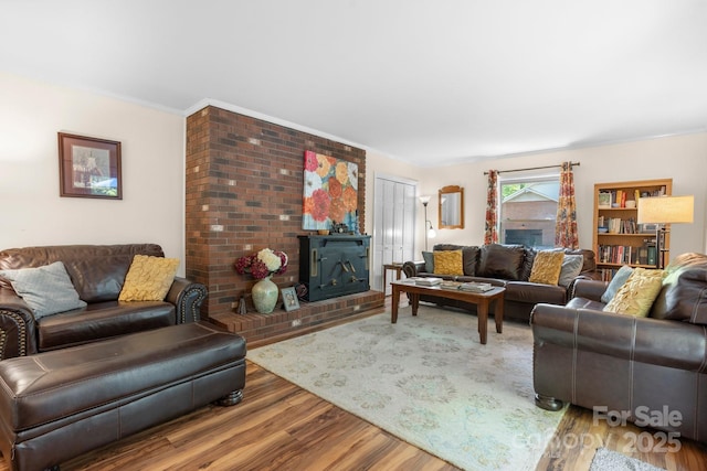 701 5th Ave NE, Conover, NC 28613 - living area with wood finished floors, a brick fireplace, and crown molding