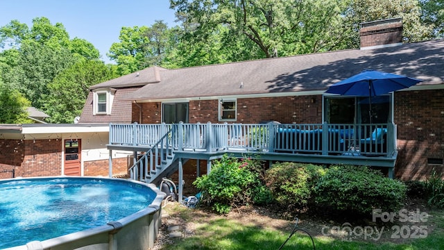 701 5th Ave NE, Conover, NC 28613 - rear view of house with brick siding, a deck, stairway, a chimney, and a shingled roof