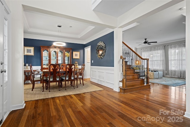 422 Deer Brush Ln, Waxhaw, NC 28173 - dining area featuring hardwood / wood-style floors, stairs, a wainscoted wall, ornamental molding, and ceiling fan