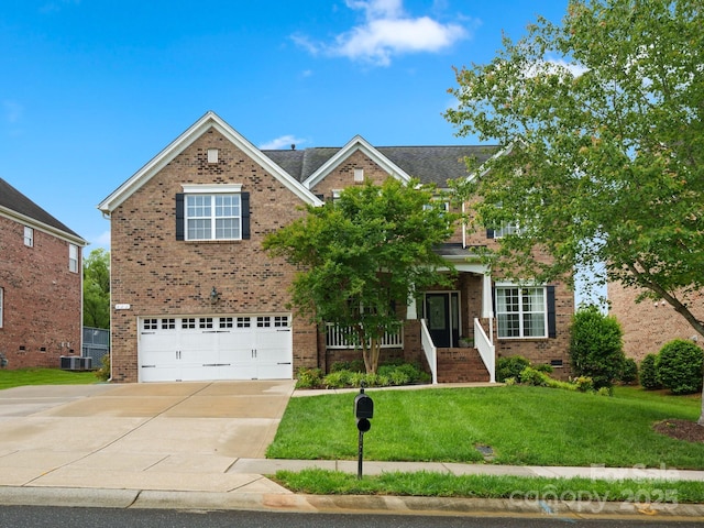 422 Deer Brush Ln, Waxhaw, NC 28173 - traditional-style home with brick siding, a garage, driveway, a front yard, and crawl space