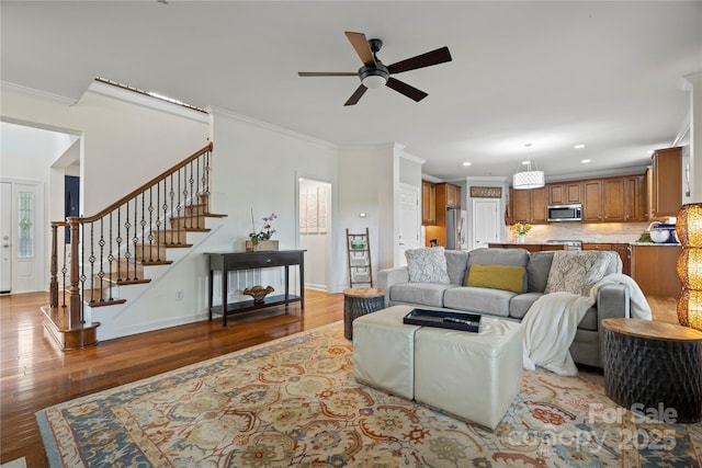 422 Deer Brush Ln, Waxhaw, NC 28173 - living area with a ceiling fan, wood finished floors, crown molding, recessed lighting, and stairway
