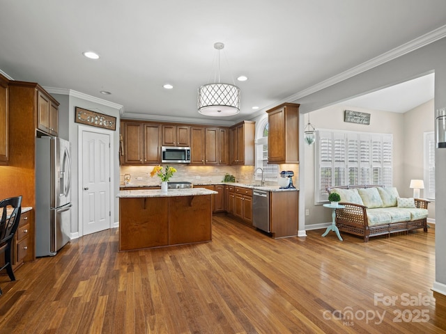 422 Deer Brush Ln, Waxhaw, NC 28173 - kitchen with stainless steel appliances, a center island, dark wood-style flooring, decorative backsplash, and open floor plan
