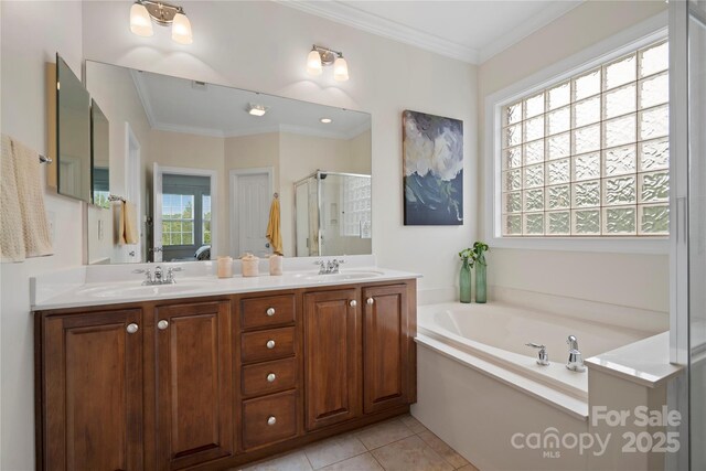 422 Deer Brush Ln, Waxhaw, NC 28173 - full bath with a stall shower, a garden tub, double vanity, ornamental molding, and tile patterned floors