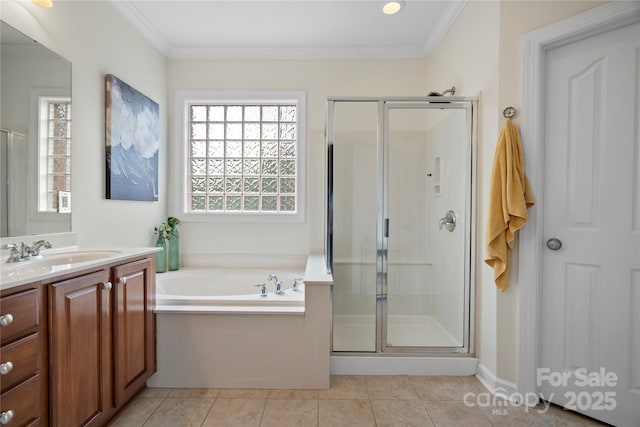 422 Deer Brush Ln, Waxhaw, NC 28173 - bathroom with vanity, a shower stall, a garden tub, crown molding, and tile patterned floors
