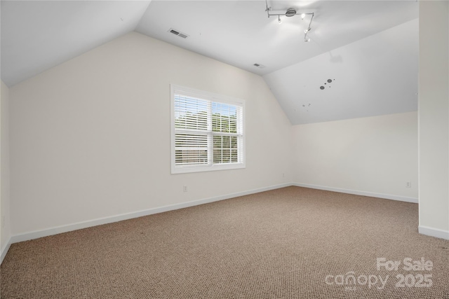 422 Deer Brush Ln, Waxhaw, NC 28173 - additional living space featuring vaulted ceiling and carpet flooring