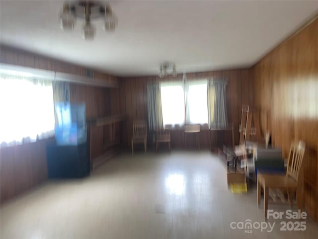 205 Rudolph Rd, Salisbury, NC 28146 - living area featuring a chandelier and wood walls
