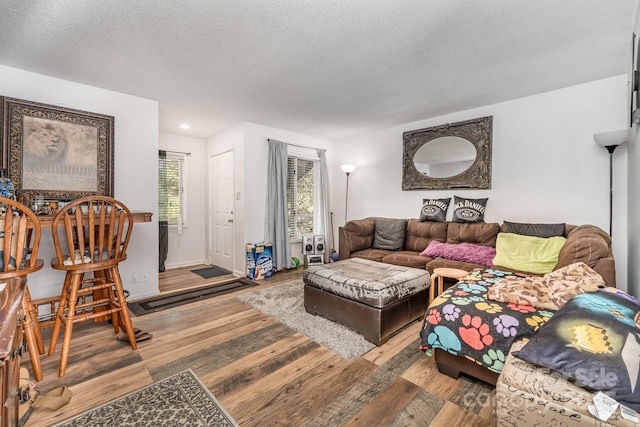 2026 Harvest Ln, Charlotte, NC 28210 - living area featuring baseboards, recessed lighting, a textured ceiling, and wood finished floors