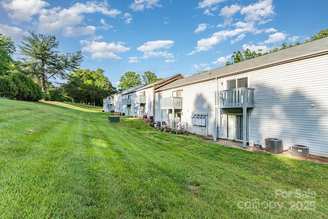 2026 Harvest Ln, Charlotte, NC 28210 - view of yard featuring central air condition unit and a balcony
