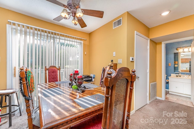 2026 Harvest Ln, Charlotte, NC 28210 - carpeted dining space with visible vents, a sink, baseboards, and ceiling fan