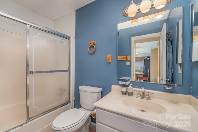 2026 Harvest Ln, Charlotte, NC 28210 - bathroom with vanity, shower / bath combination with glass door, and toilet