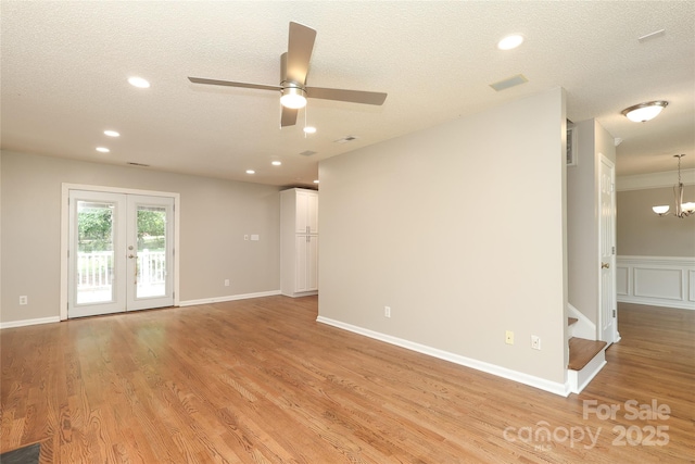 2011 Redwood Dr, Indian Trail, NC 28079 - spare room with a ceiling fan, light wood-style floors, a chandelier, french doors, and recessed lighting