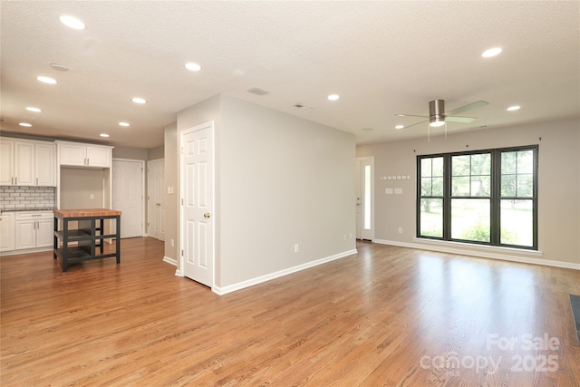 2011 Redwood Dr, Indian Trail, NC 28079 - unfurnished living room with ceiling fan, recessed lighting, and light wood-type flooring