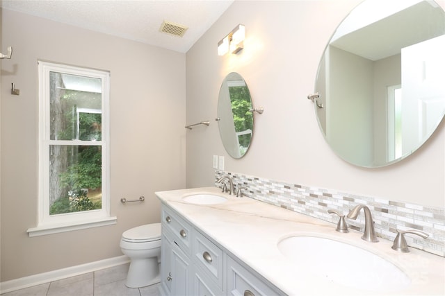 2011 Redwood Dr, Indian Trail, NC 28079 - full bath featuring double vanity, tile patterned flooring, and decorative backsplash