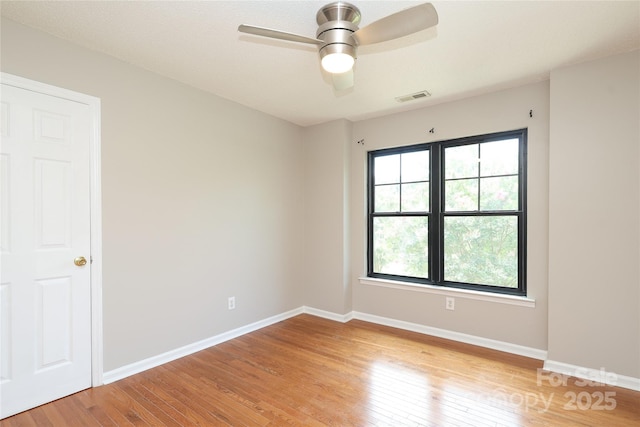 2011 Redwood Dr, Indian Trail, NC 28079 - spare room featuring light wood-style flooring, healthy amount of natural light, and a ceiling fan