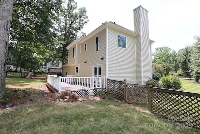 2011 Redwood Dr, Indian Trail, NC 28079 - rear view of house featuring a chimney and a wooden deck