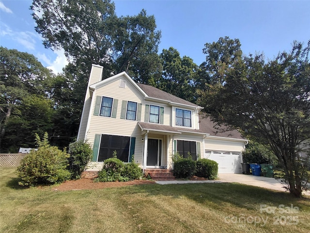 2011 Redwood Dr, Indian Trail, NC 28079 - traditional home featuring a chimney, a front yard, a garage, and concrete driveway