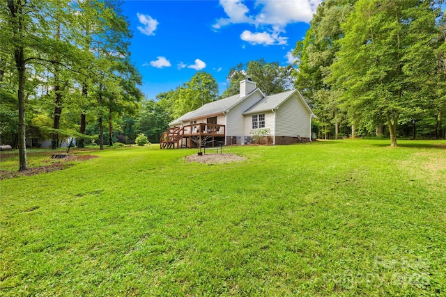 5903 Wm Griffin Rd, Monroe, NC 28112 - view of grassy yard featuring a deck and view of scattered trees