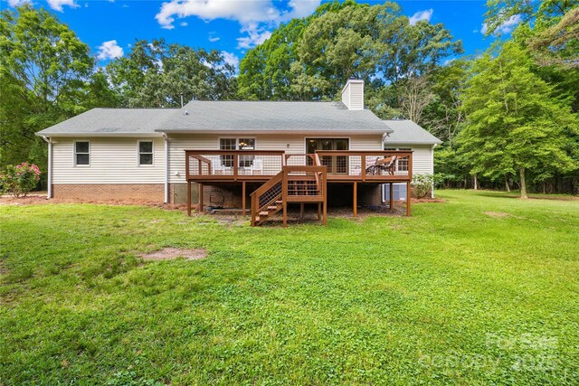 5903 Wm Griffin Rd, Monroe, NC 28112 - back of property with a wooden deck, a chimney, a yard, and stairway