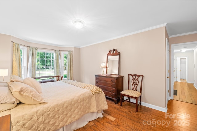 5903 Wm Griffin Rd, Monroe, NC 28112 - bedroom featuring wood-type flooring, ornamental molding, and baseboards