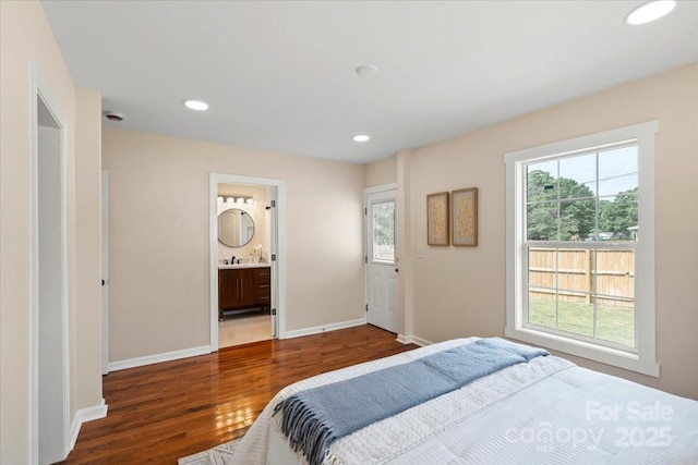 bedroom featuring baseboards, recessed lighting, and wood finished floors