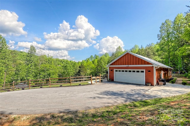 202 Wild Pear Ln Unit 3 & 7A, Franklin, NC 28734 - detached garage with fence and a forest view