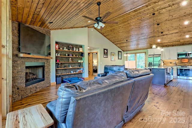 202 Wild Pear Ln Unit 3 & 7A, Franklin, NC 28734 - living room with light wood finished floors, wooden ceiling, ceiling fan, a stone fireplace, and recessed lighting