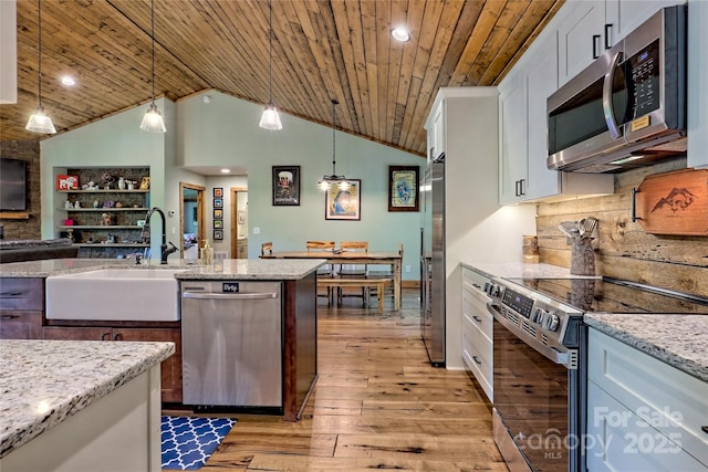 202 Wild Pear Ln Unit 3 & 7A, Franklin, NC 28734 - kitchen featuring appliances with stainless steel finishes, a sink, wood ceiling, light wood-style flooring, and white cabinetry