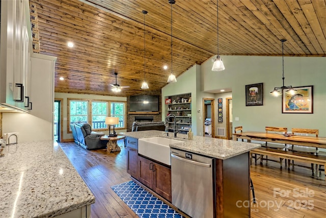 202 Wild Pear Ln Unit 3 & 7A, Franklin, NC 28734 - kitchen featuring stainless steel dishwasher, a sink, a fireplace, a ceiling fan, and hardwood / wood-style flooring