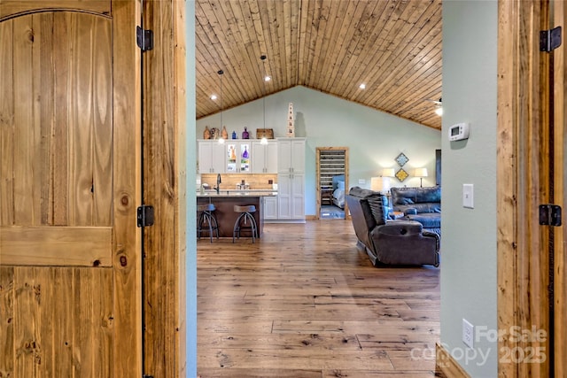 202 Wild Pear Ln Unit 3 & 7A, Franklin, NC 28734 - living area with light wood-type flooring, lofted ceiling, and wooden ceiling