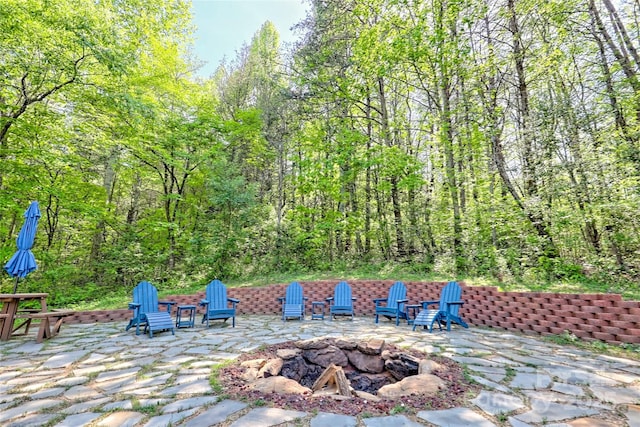 202 Wild Pear Ln Unit 3 & 7A, Franklin, NC 28734 - view of patio featuring an outdoor fire pit and a view of trees